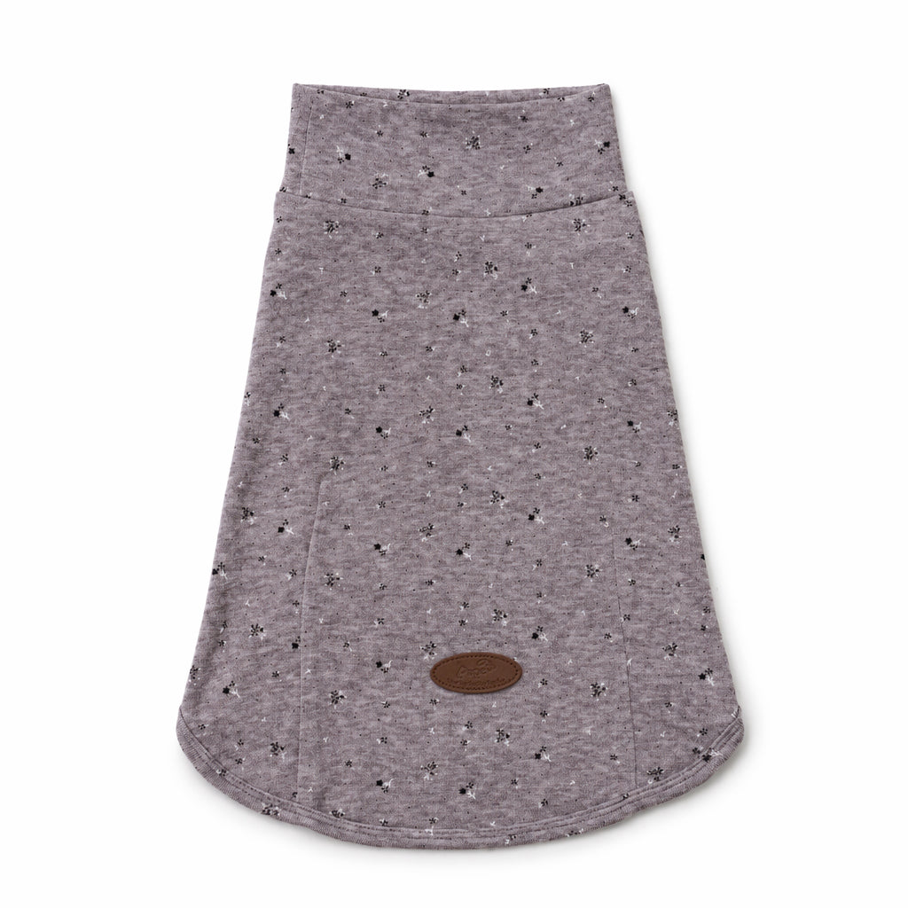 Flat lay of a gray speckled dog tee with a curved hem and leather logo patch, featuring soft dog apparel and comfortable small dog clothes for everyday pet clothing.